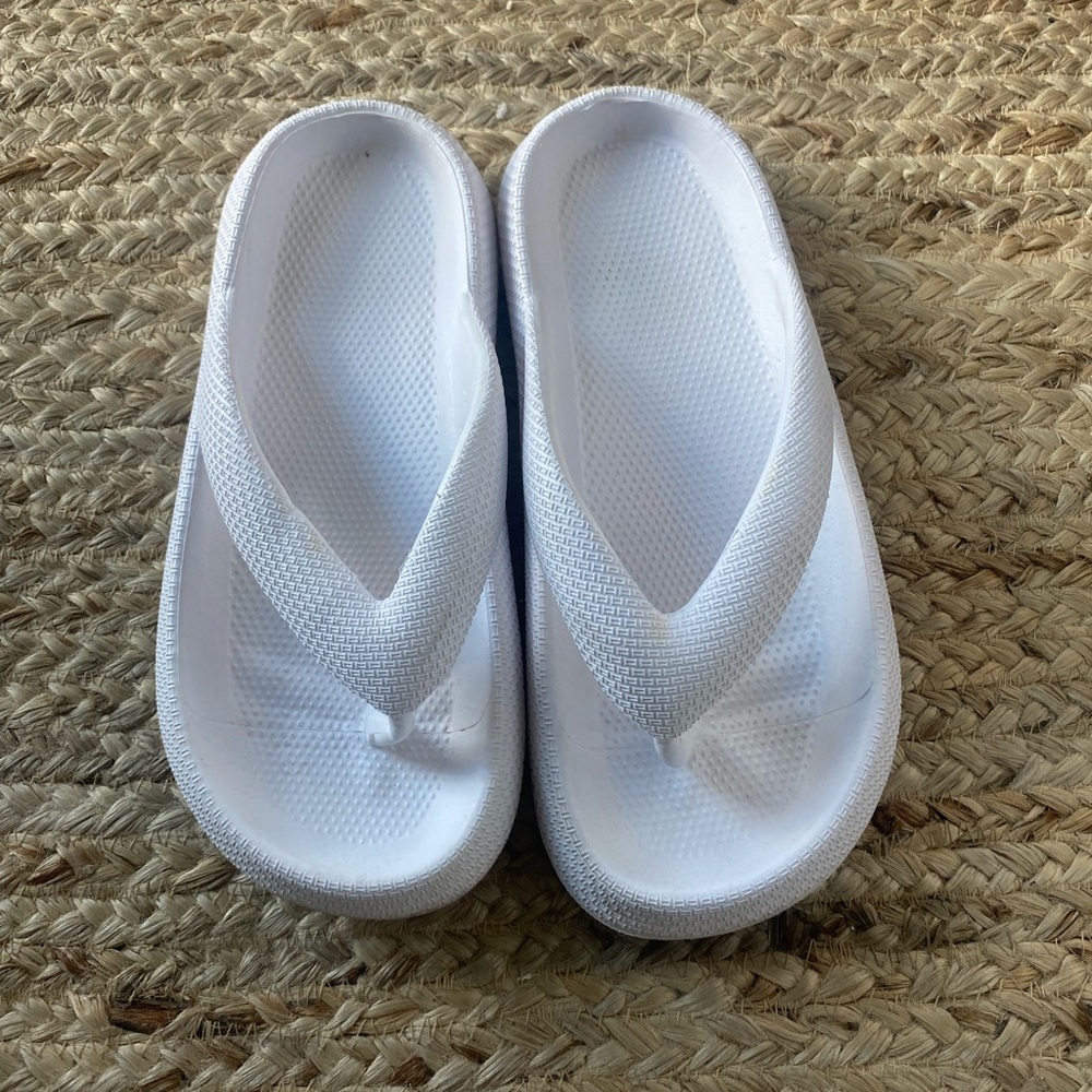 Rubber white flip flops